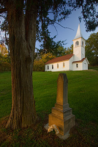 The Ingemann Danish Church and Cemetery west of Moorhead in the Loess Hills of Iowa was founded by early immigrants in 1884. This unique country church offers a scenic respite for travelers. - Iowa Photograph