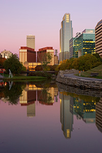 Downtown Omaha, Nebraska on the Gene Leahy Mall in the Early Morning just before sunrise.  The two larger skyscrapers, the Woodman Tower and the First National Bank building dominate the skyline. - Nebraska Photograph