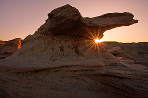 On a cool September evening, the final light of the setting sun pierces under one of the unique 'Toadstools' at Toadstool Geologic Park near Crawford. - Nebraska Photograph