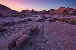 Sunrise begins to illuminate the erie formations at Toadstool Geologic Park in western Nebraska. - Nebraska Photograph