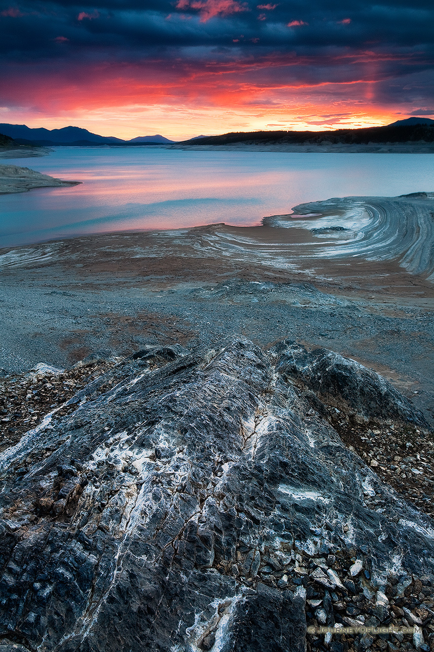 The sun illuminates the clouds on Lake Abraham on the Kootenay Plains in Western Alberta. - Alberta Picture