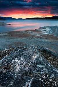 The sun illuminates the clouds on Lake Abraham on the Kootenay Plains in Western Alberta. - Canada Photograph