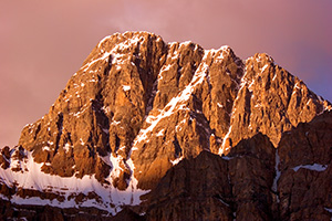 The peaks of the Bow Range with an intense glow from the rising sun. - Rockies Photograph