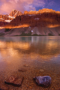 Bow Lake in Banff National Park at sunrise.  I awoke early in order to travel from Canmore to Bow Lake to capture the early sun hitting the mountains over Bow Lake. - Canada Photograph