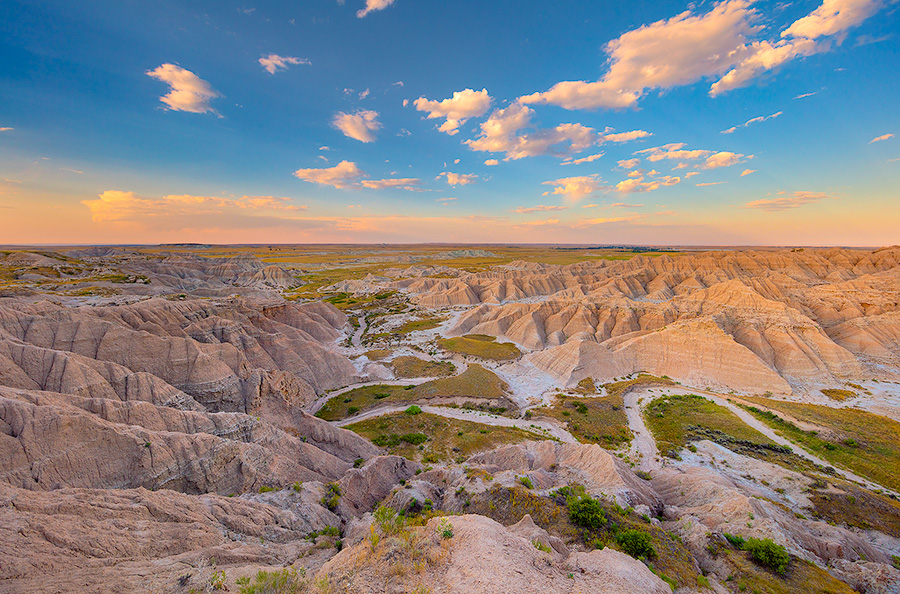 A scenic landscape photograph of sunset over the badlands Toadstool Geologic Park in western Nebraska. - Nebraska Photography