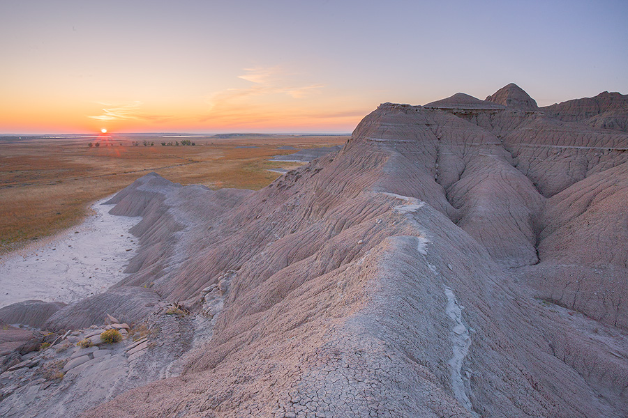 The sun rises over the western Nebraska plains from atop a ridge in Toadstool Geologic Park. - Toadstool Geologic Park Photography