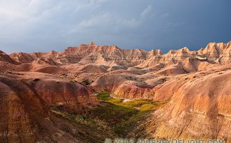 One of the things that I can say about visiting Badlands National Park in South Dakota is that the weather is almost always very dynamic when I am there. I rarely have times when it is all sunny or all cloudy. Usually, when the sun bursts forth there is some great color in the sky. During the day clouds lazily float by and then in the afternoon I am often treated to a spectacular storm. This image is from one such evening, a summer storm was rolling through and the sunlight was streaming through the clouds illuminating the badlands landscape.