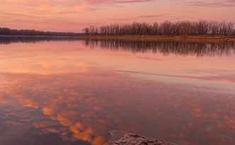 With nary a breeze and no other soul in sight, I enjoyed the vibrant colors brought forth from this sunrise in a quiet peacefulness and solitude.