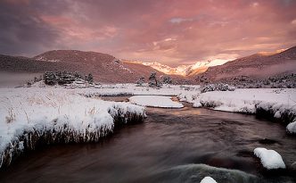 On a cold day in mid-May, the Big Thompson flows through Moraine Park as the first sunlight of the day illuminates the peaks of the Continential Divide.