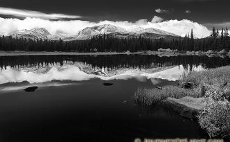Just after a short storm rolled through, Red Rock Lake was still reflecting the mountains and clouds in the distance.
