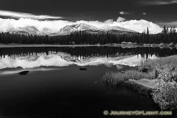 Just after a short storm rolled through, Red Rock Lake was still reflecting the mountains and clouds in the distance.