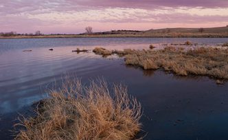 Dusk descends over a pond on the Little Salt Fork Marsh in Lancaster County near Raymond, Nebraska.