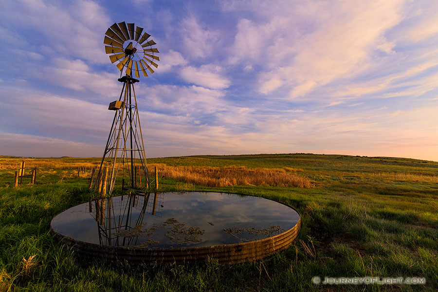 The previous night a storm had moved through Sandhills and Crescent Lake National Wildlife Refuge in western Nebraska. As the morning sun rose in the east, the grasses and clouds glowed with vibrant pastel colors.