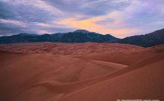 As the last of the light of the day diminishes at Great Sand Dunes National Park, a single set of clouds remain illuminated before quietly going dim.