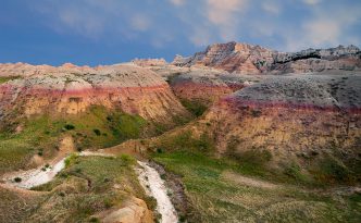 Mammatus clouds hover over the Badlands signaling an approaching storm on a warm summer evening.