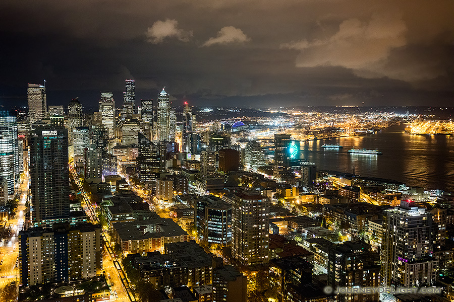 The city of Seattle stretches out into the distance from the vantage of the Space Needle.