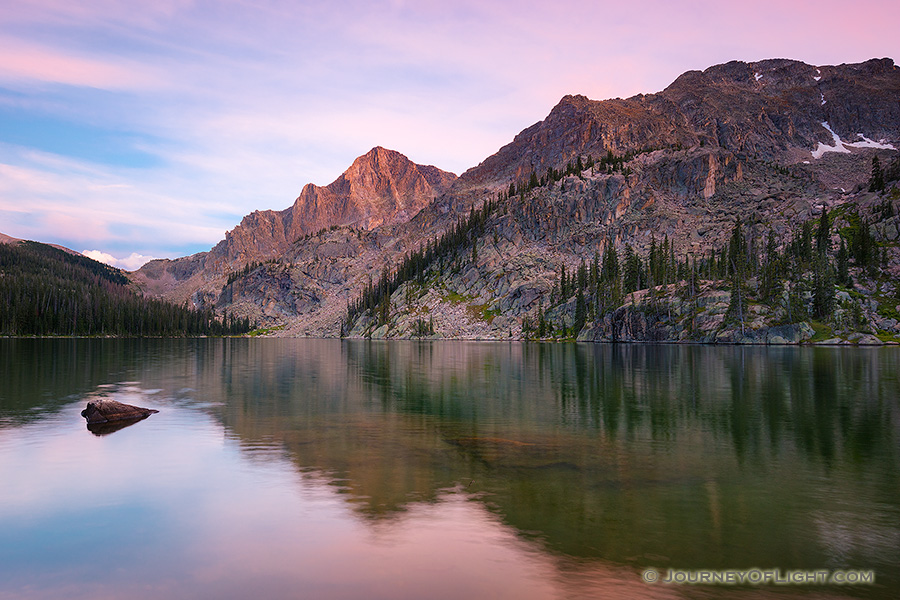 Nestled under Andrews Peak, dusk falls on the beautiful Nanita Lake in the backcountry of Rocky Mountain National park. - Colorado Photography