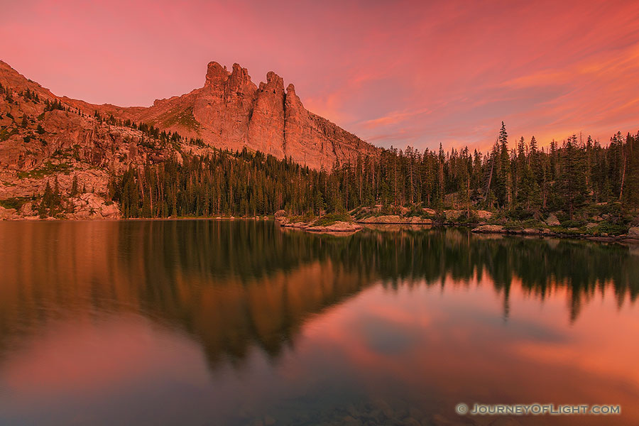 The warmth of a summer sunrise bathes Lake Nanita and Ptarmigan Mountain in a warm red glow. - Colorado Photography
