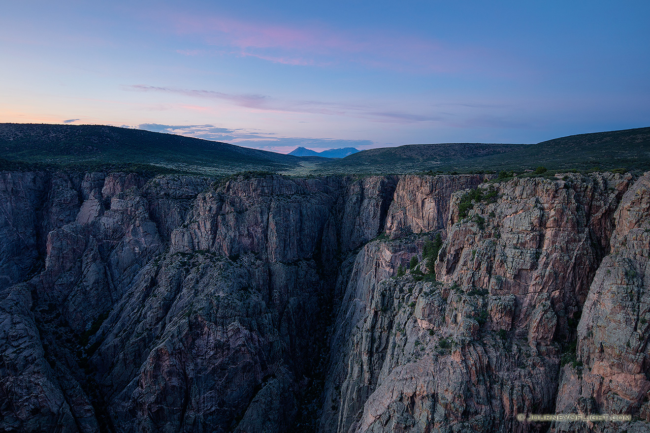 As twilight descends into the Black Canyon of the Gunnison blue hues dominate the sky and the walls. - Colorado Picture