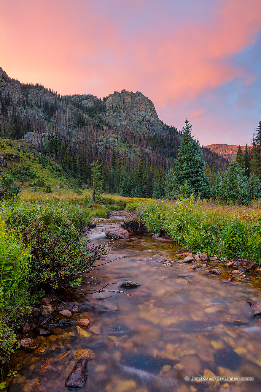 A scenic photograph of Tonahutu creek and a sunset at Rocky Moutain National Park, Colorado. - Colorado Picture