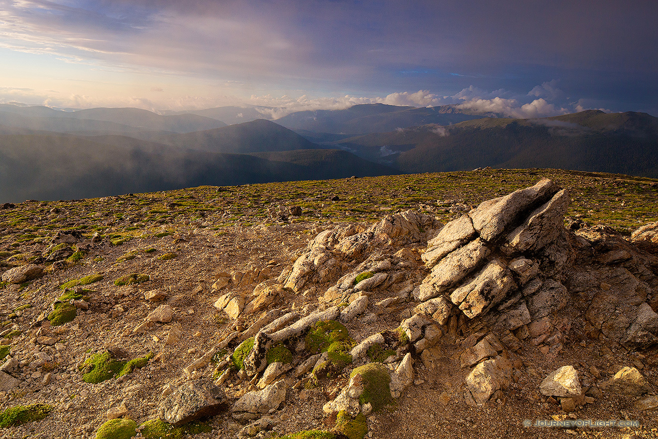 High upon the tundra, fog rolls through as the sun begins to set over the Never Summer Range in Rocky Mountain National Park. - Colorado Picture