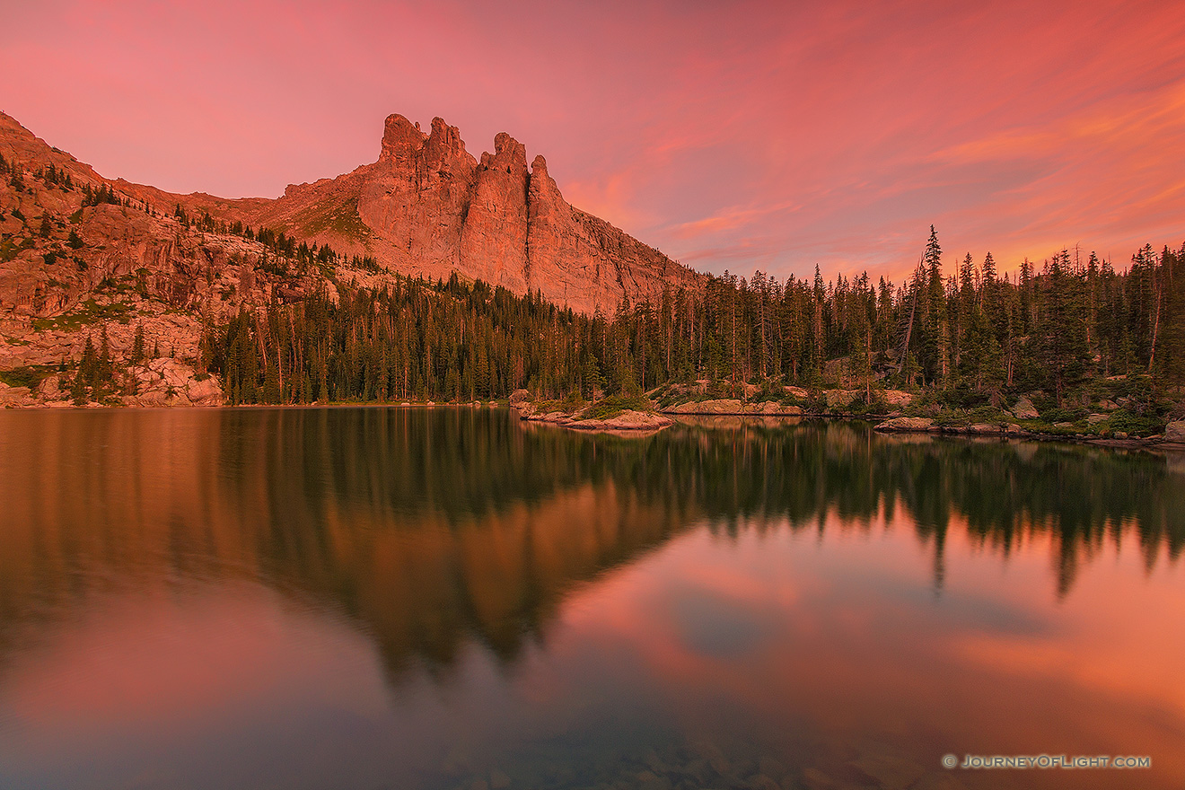 The warmth of a summer sunrise bathes Lake Nanita and Ptarmigan Mountain in a warm red glow. - Colorado Picture