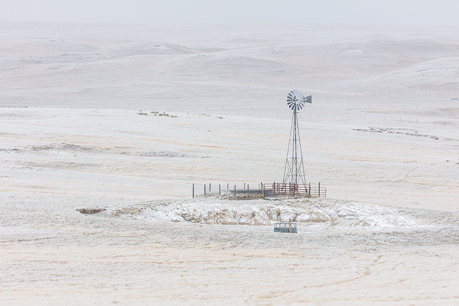 Scenic landscape panoramic photograph of a windmill in the winter at Oglala National Grasslands. - Nebraska Photography