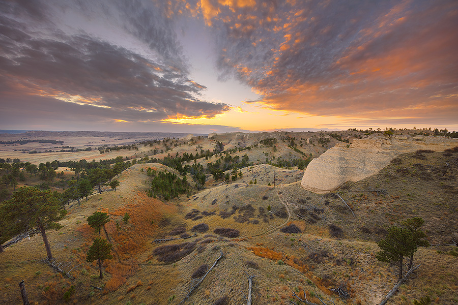 A scenic landscape photograph of a beautiful sunset over Fort Robinson State Park in Northwestern Nebraska. - Nebraska Photography