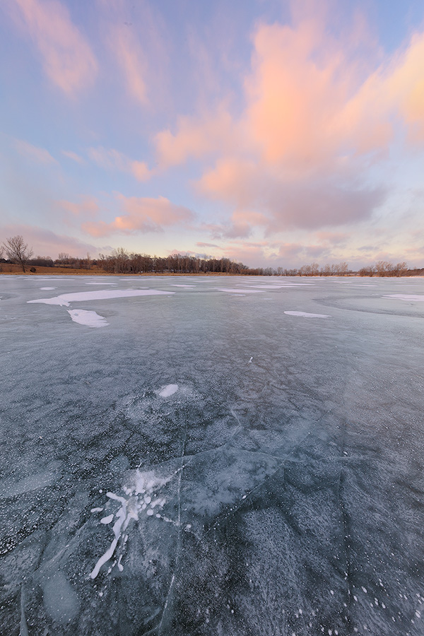 On a frigid January day clouds hover over the frozen Wehrspann Lake at Chalco Hills Recreation Area in Sarpy County, Nebraska. - Nebraska Photography