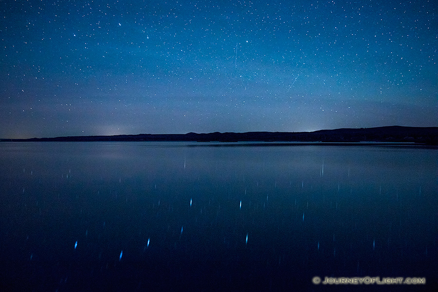 On a clear night at Niobrara State Park the stars shone brightly above the Missouri River.  In the reflection of the river the Big Dipper can be clearly seen. - Nebraska Photography