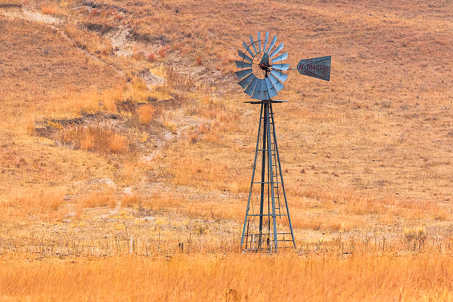 A scenic landscape photograph of a windmill in the sandhills of Nebraska. - Nebraska Photography