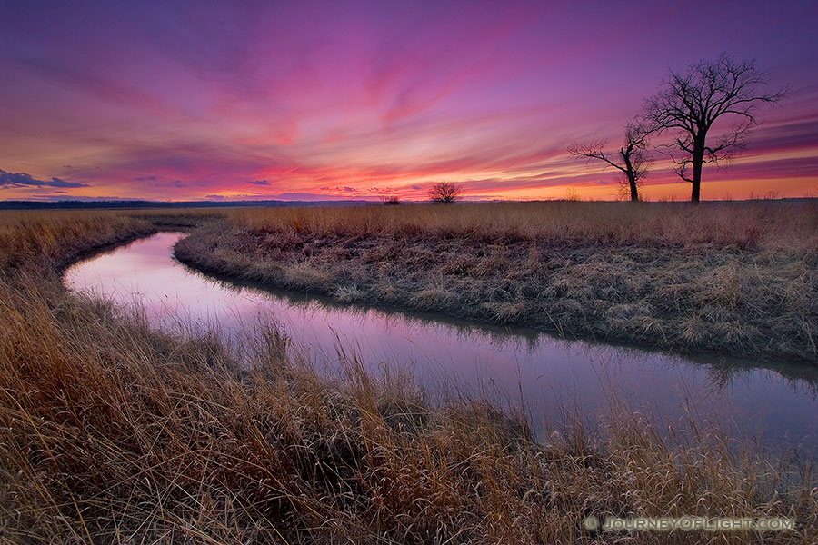 A small chute flows toward an early spring sunset through a tract of native prairie grasses at Boyer Chute National Wildlife Refuge near Ft. Calhoun. - Boyer Chute Photography