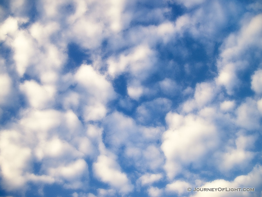 As a child I would lie on my back and watch the clouds lazily float by.  An image reminiscent of those days. - Nebraska Photography