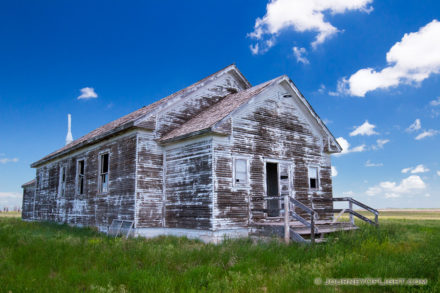 An old abandoned one room schoolhouse sits on the side of the highway near Hemingford, Nebraska. - Nebraska Photography