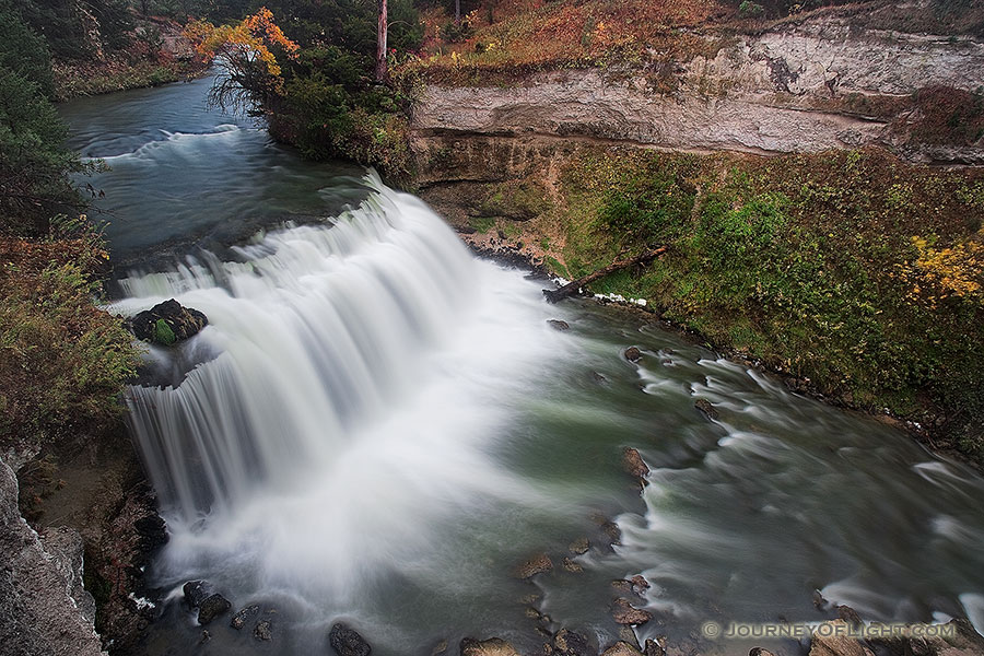 Not far from Merritt Reservoir in Cherry County, Nebraska, water flows over Snake River Falls. - Nebraska Photography