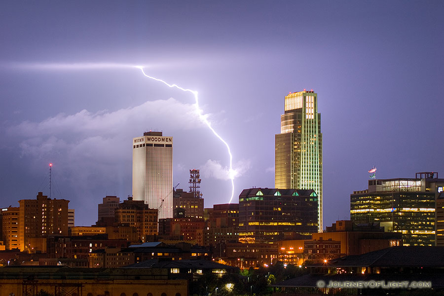 While setting up to capture the 9/11 tribute in downtown Omaha I instead witnessed a spectacular fall storm.  I managed to capture this lightning between the Woodmen Tower and the First National Bank Tower. - Omaha Photography