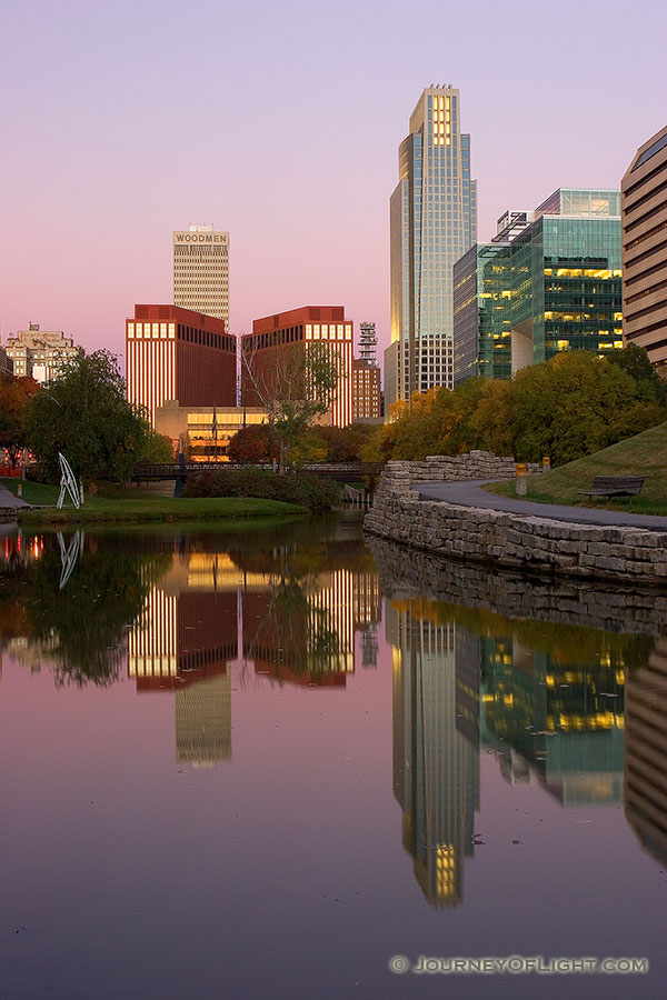 Downtown Omaha, Nebraska on the Gene Leahy Mall in the Early Morning just before sunrise.  The two larger skyscrapers, the Woodman Tower and the First National Bank building dominate the skyline. - Omaha Photography