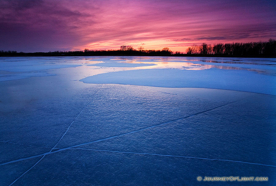 The former oxbow of the Missouri River, DeSoto Bend is completely frozen on a frigid January evening. - DeSoto Photography
