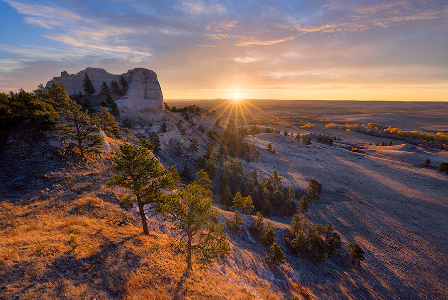 A scenic landscape photograph of a beautiful sunrise over Fort Robinson State Park in Northwestern Nebraska. - Nebraska Photography