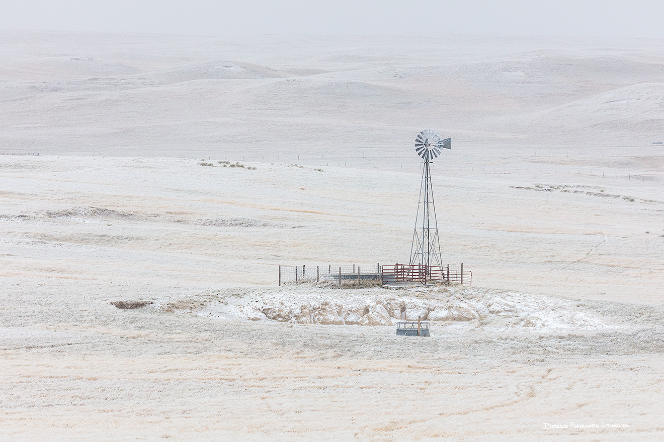 Scenic landscape panoramic photograph of a windmill in the winter at Oglala National Grasslands. - Nebraska Picture
