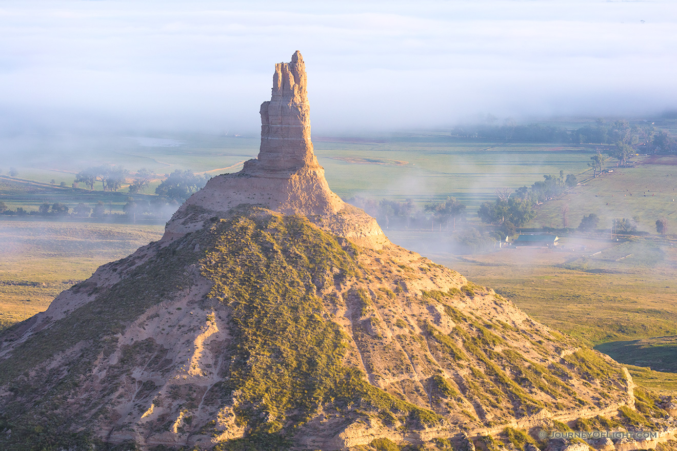 Morning Fog surrounds Chimney Rock in western Nebraska at sunrise. - Nebraska Picture