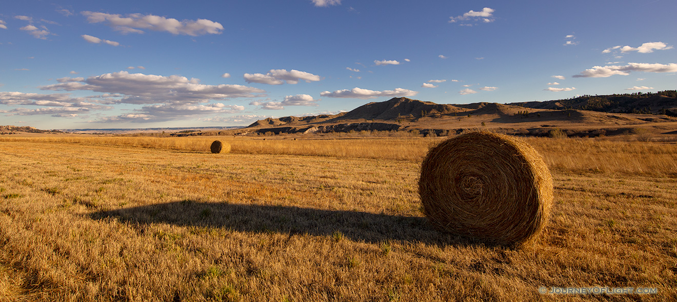 A scenic landscape pano photograph of hay bales at Ft. Robinson in Northwestern Nebraska. - Nebraska Picture