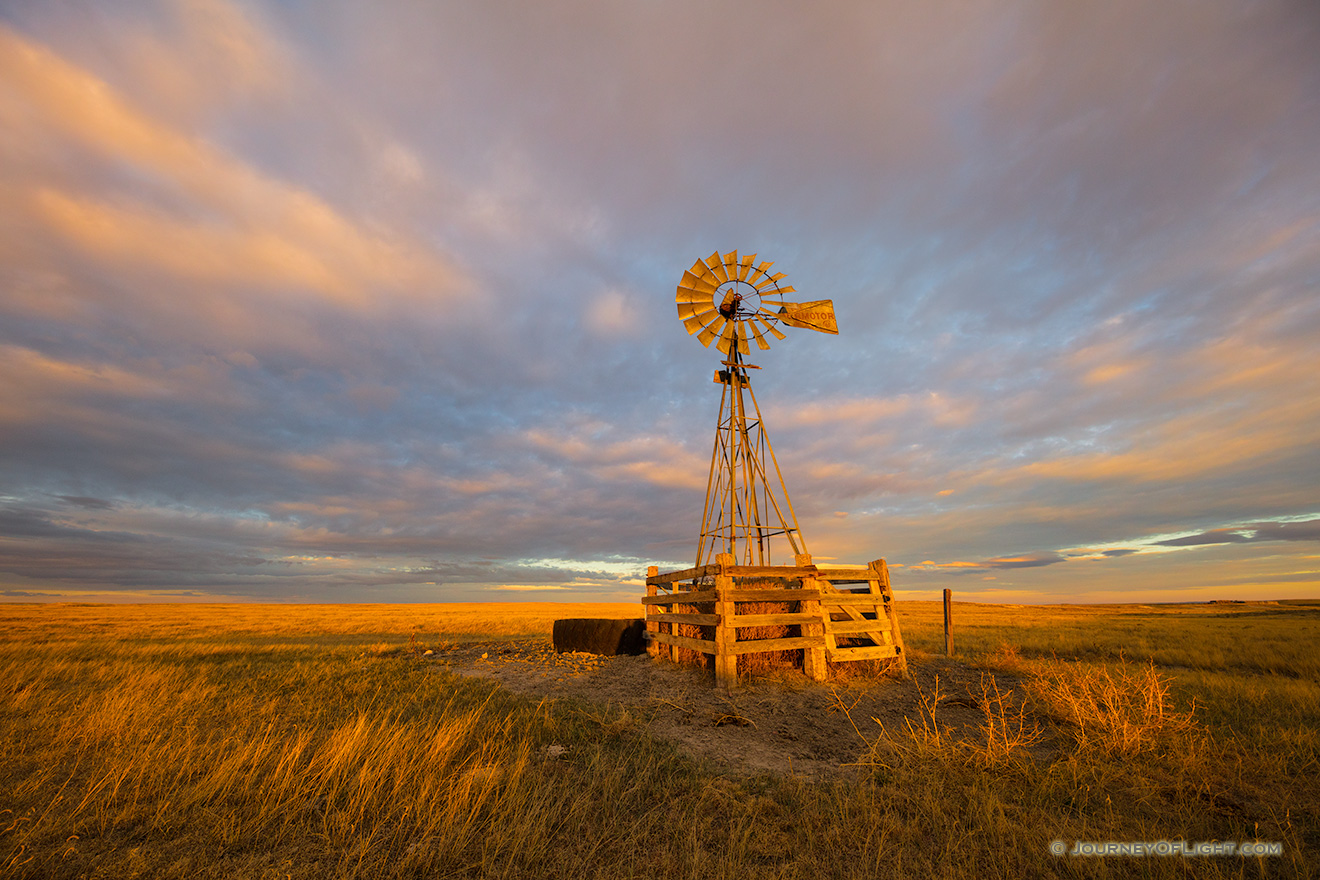 Scenic landscape photograph of a windmill at sunset at Oglala National Grasslands. - Nebraska Picture