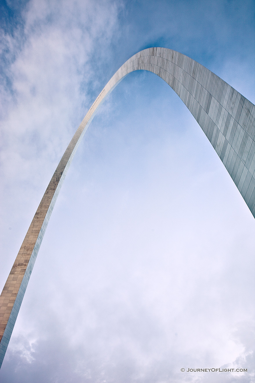 Built between February 12, 1963, and October 28, 1965 the Gateway Arch in St. Louis was designed to honor the westward expansion of the United States.  Designed by architect Eero Saarinen and engineer Hannskarl Bandel, it is 630 feet wide at its base and 630 feet tall and is currently the tallest monument in the United States.  From the base of the north leg looking in a south easterly directly, the structure curves through the sky almost touching the low clouds.  - Jefferson National Expansion Memorial Picture