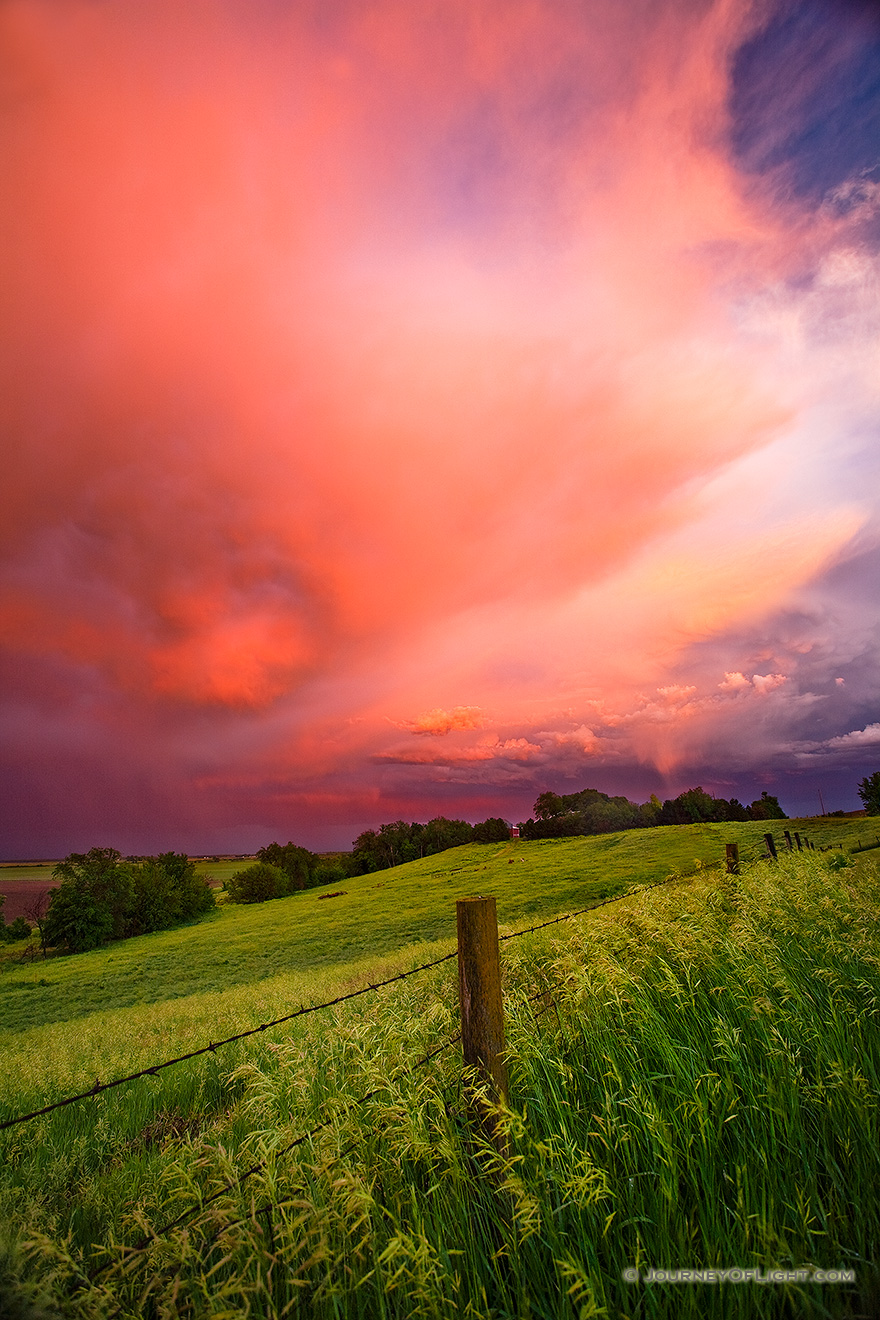 A photograph of one of a stunning display of sunset light illuminating high clouds following a late afternoon intense storm on the plains of Nebraska. - Nebraska Picture