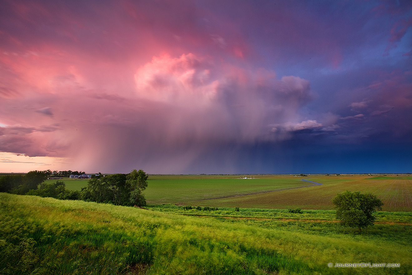 A fierce midwestern storm filled with lightning, moves quickly east across the Nebraska plains into Iowa. - Nebraska Picture