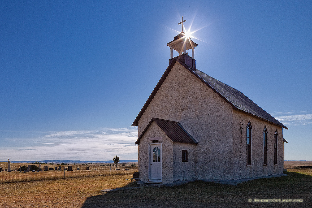 The 1887 Immaculate Conception Catholic Church and Cemetery are all that remain of the Montrose, Nebraska on the wind-swept prairie of the Oglala National Grassland. - Nebraska Picture