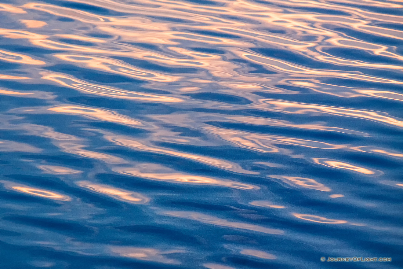 Ripples reflecting the rising sun on a lake at Mahoney State Park on a warm Mary morning. - Mahoney SP Picture