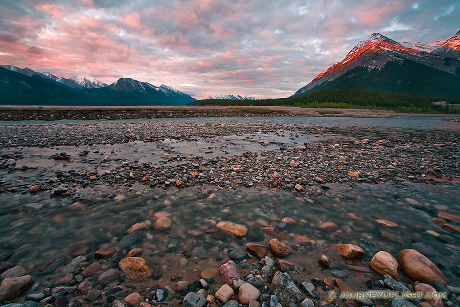 A cool breeze blows across the cool landscape as the morning sun briefly illuminates the peaks on the Kootenay plains. - Canada Photography