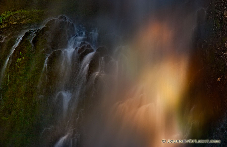 Focused on a small section of Multnomah Falls where the setting sun illuminated a small area creating a rainbow in the mist. - Pacific Northwest Photography